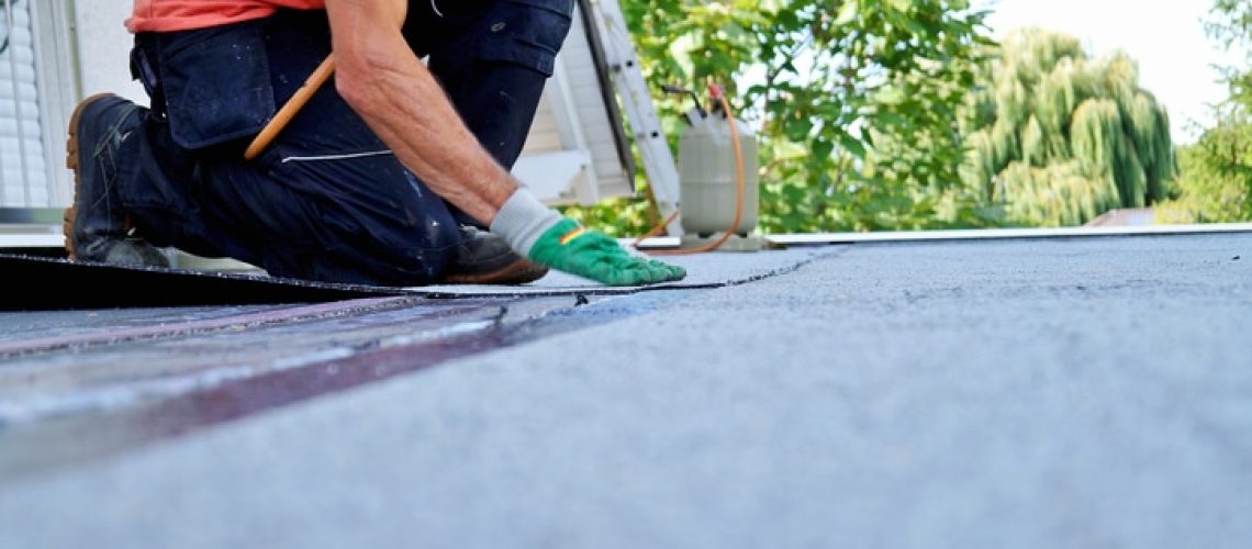 Roofing felt. Roofer working. Roofer working tool. Waterproofing
