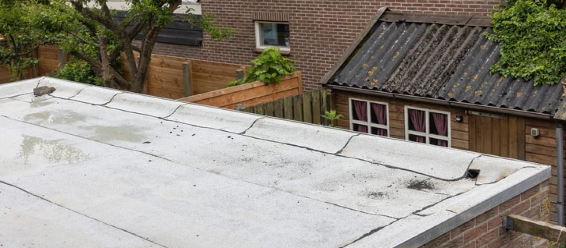 Flat roof with new white roofing felt or bitumen